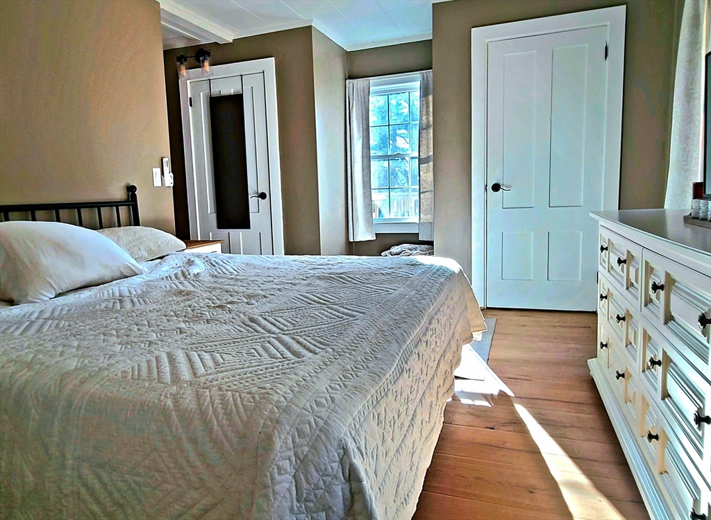 49 Anderson Avenue Middleboro, MA 02346 - Photo 12 of 25 a bedroom with a bed and a mirror
