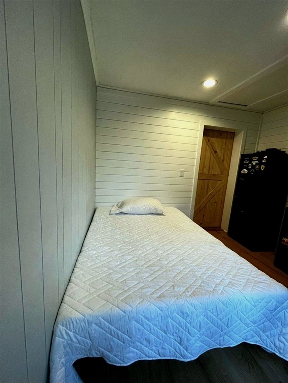 49 Anderson Avenue Middleboro, MA 02346 - Photo 13 of 25 a bedroom with a bed and wooden floor
