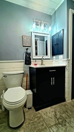 49 Anderson Avenue Middleboro, MA 02346 - Photo 17 of 25 a bathroom with a toilet sink and mirror