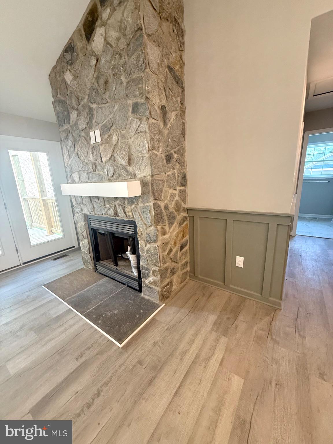 242 Howellsville Road Front Royal, VA 22630 - Photo 11 of 11 Cozy stone fireplace in modern space.