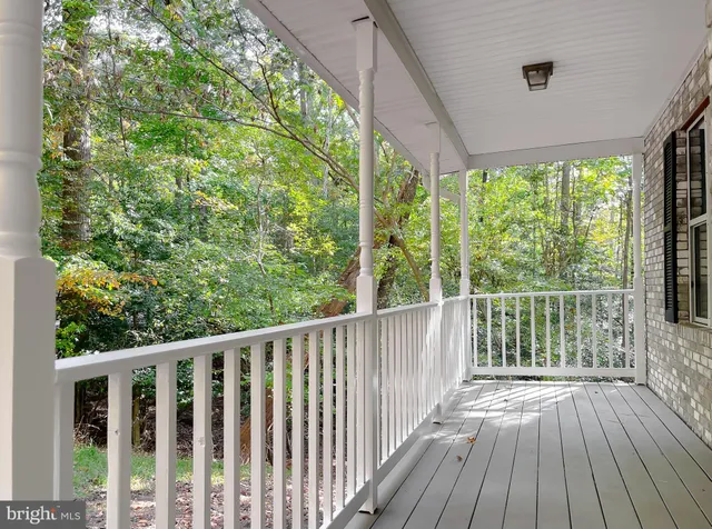 a view of balcony with wooden floor