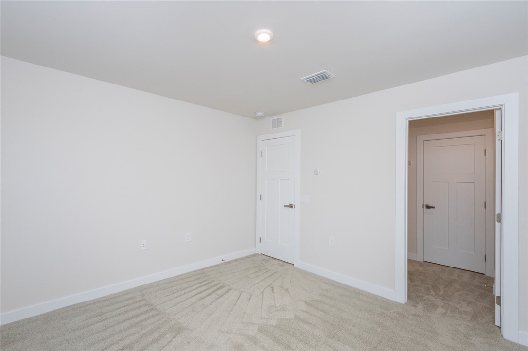233 Scenic Road Anderson, SC 29621 - Photo 38 of 50 An inviting room awaits with neutral carpet and ample natural light from above.