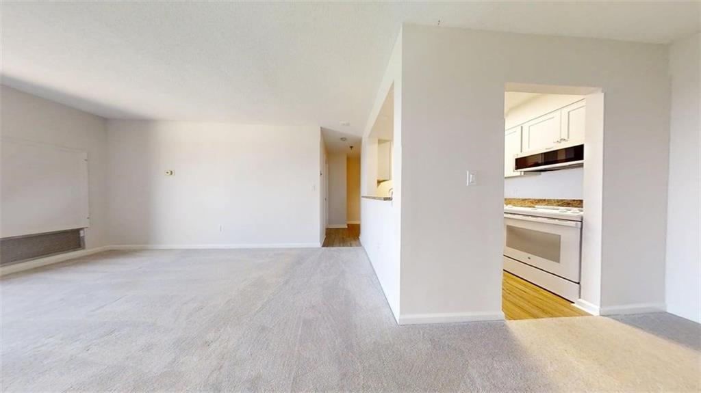 300 Johnson Ferry Road, Unit B805 Sandy Springs, GA 30328 - Photo 11 of 31 a view of an empty room and fire place