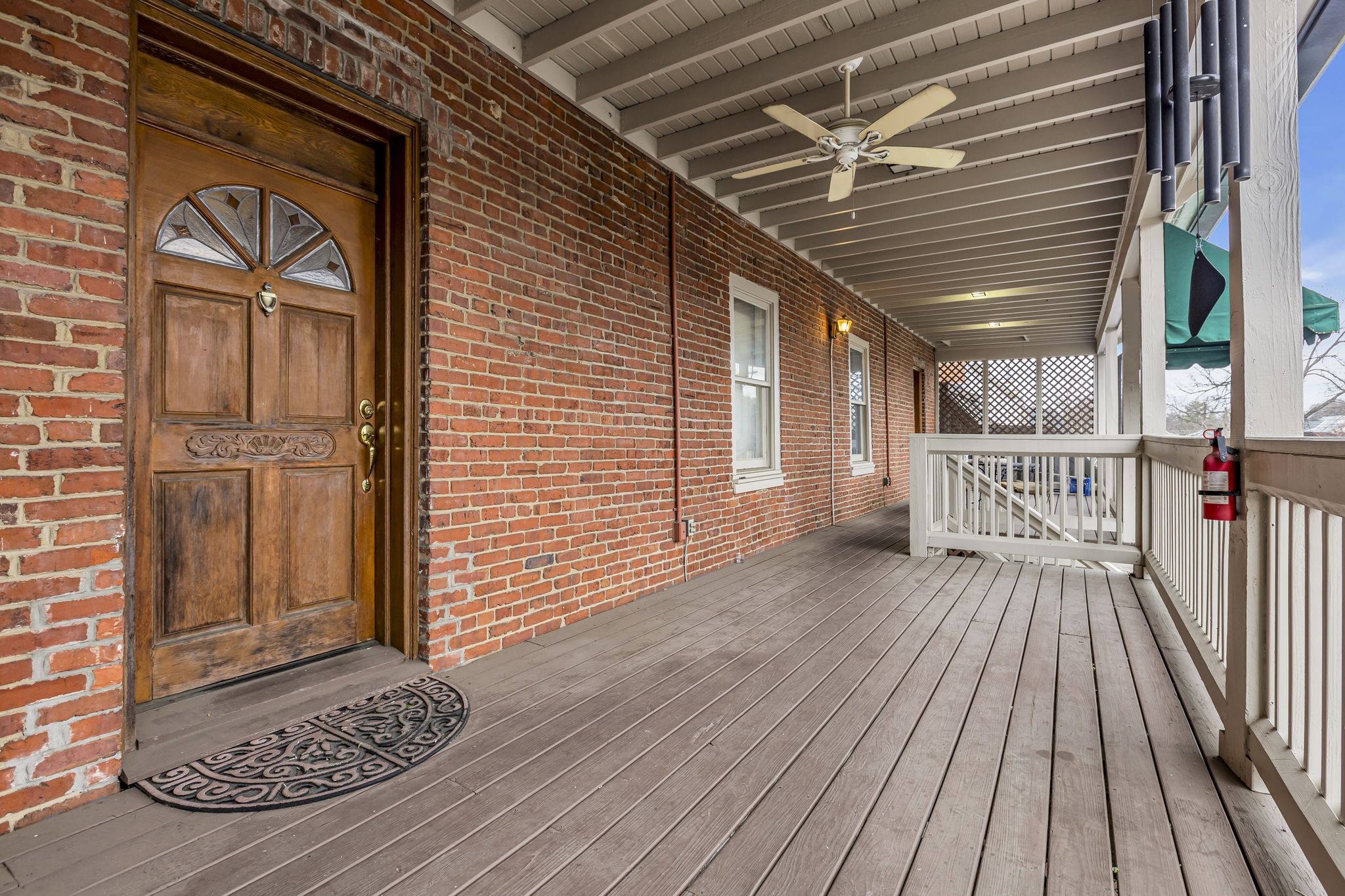 424 Main Street, Unit B Franklin, TN 37064 - Photo 13 of 14 a view of a porch with wooden floor and fence