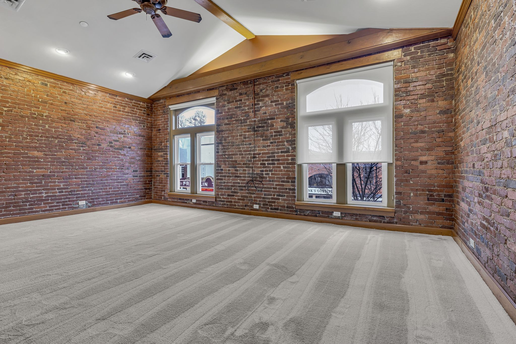424 Main Street, Unit B Franklin, TN 37064 - Photo 4 of 14 a view of an empty room with a fireplace and a window