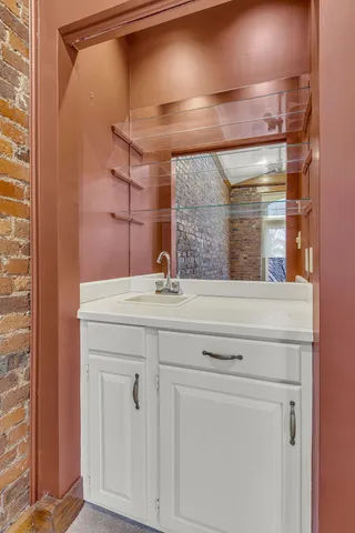 a bathroom with a sink and a mirror