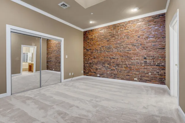 a view of an empty room with a fireplace
