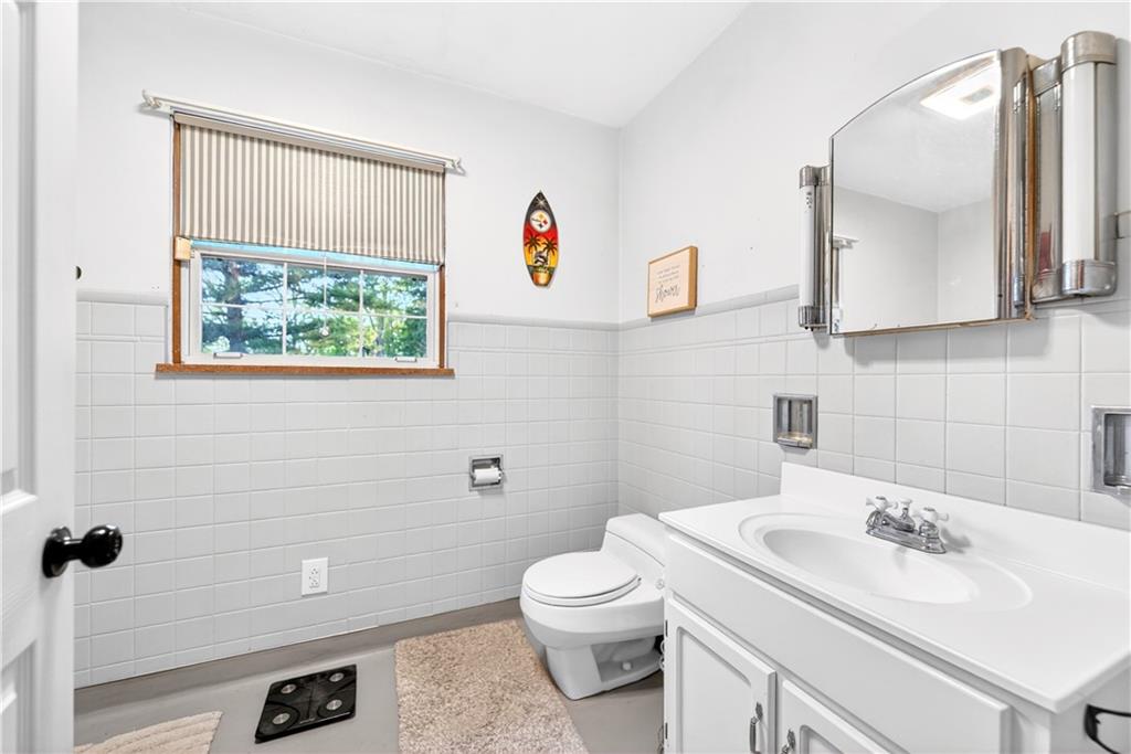 1188 Willowbrook Road Belle Vernon, PA 15012 - Photo 37 of 50 a bathroom with a sink toilet and mirror