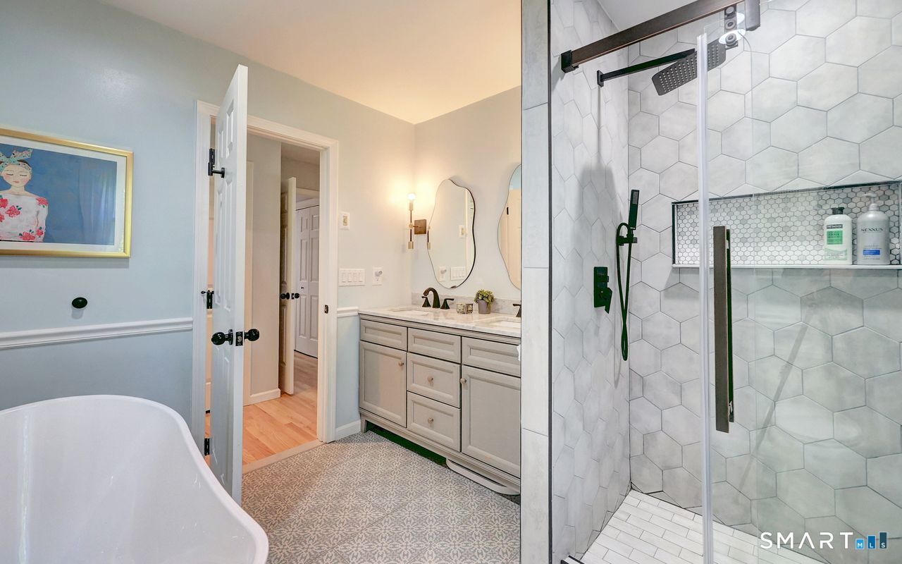 9 Canterbury Road, Unit 9 Hamden, CT 06514 - Photo 23 of 29 a bathroom with a sink a toilet and shower
