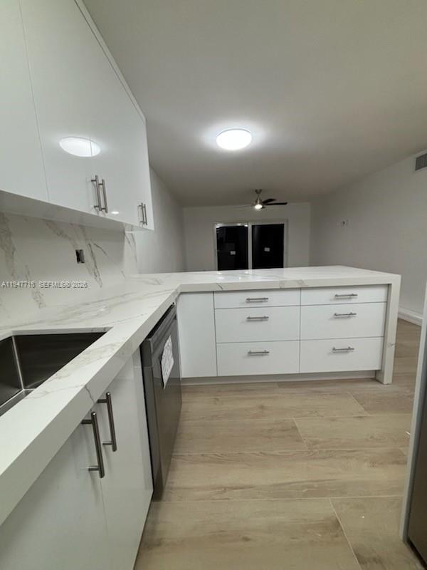 840 Southwest 129th Place, Unit 101 Miami, FL 33184 - Photo 3 of 3 a kitchen with stainless steel appliances cabinets and a sink