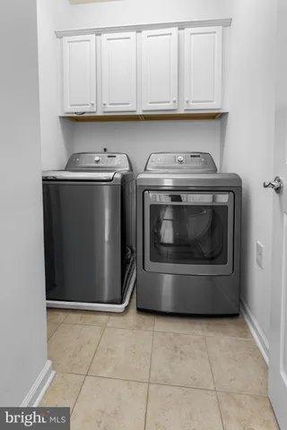 a kitchen with a stove and a refrigerator
