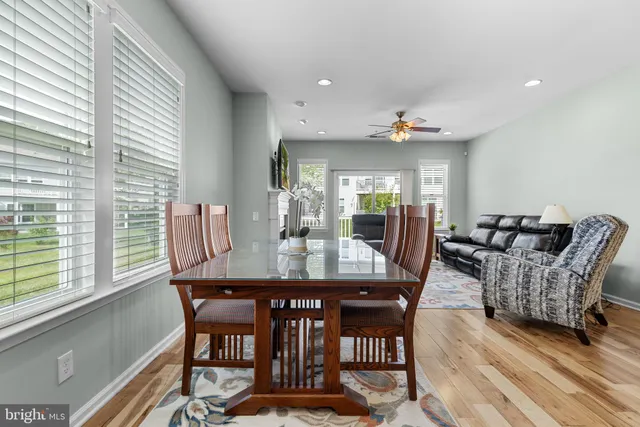 a view of a dining room with furniture and window
