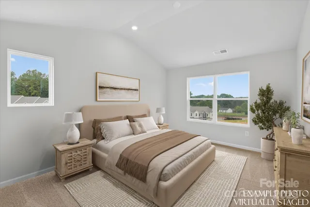 a bathroom with a granite countertop double vanity sink and mirror