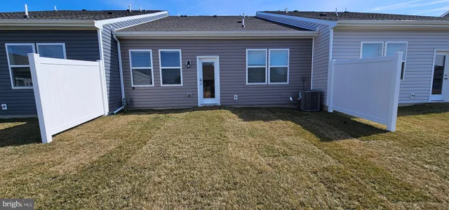 a spacious bedroom with a bed and a window