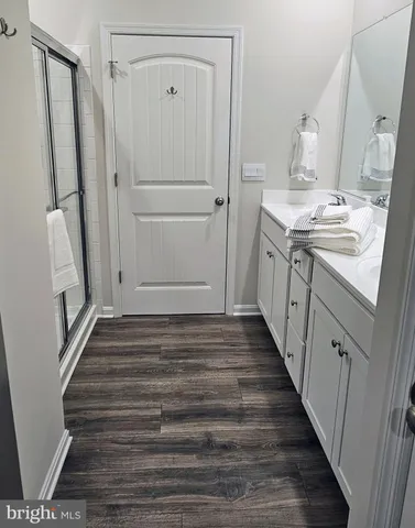 a bedroom with a bed lamp and a window