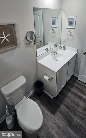 a white toilet sitting next to a shower curtain