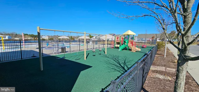 a view of a patio with swimming pool and furniture