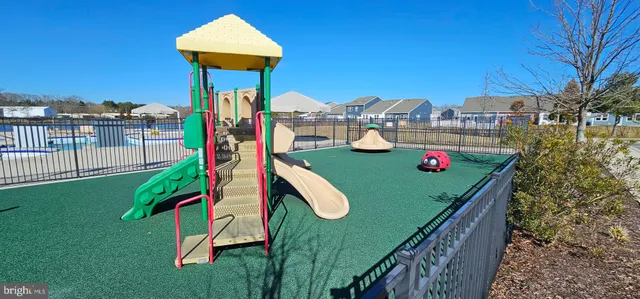 a view of swimming pool with outdoor seating and plants