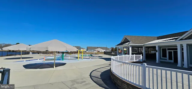 a view of a lawn chairs under an umbrella