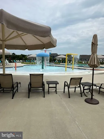a front view of a house with sitting area