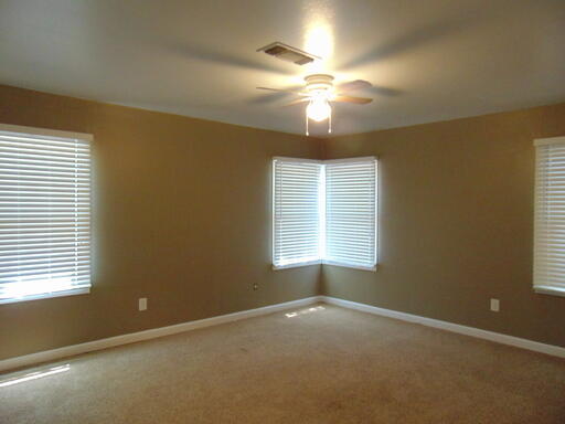 3707 24th Street Lubbock, TX 79410 - Photo 5 of 8 a view of an empty room with a window