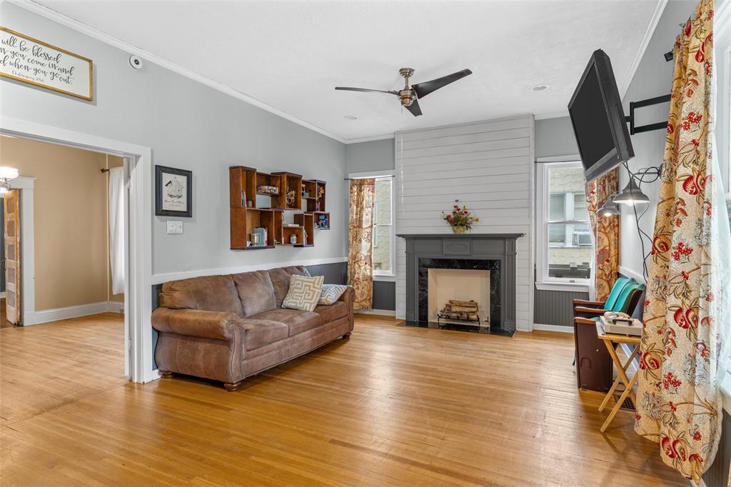2717 Colcord Avenue Waco, TX 76707 - Photo 3 of 34 a living room with furniture and a fireplace