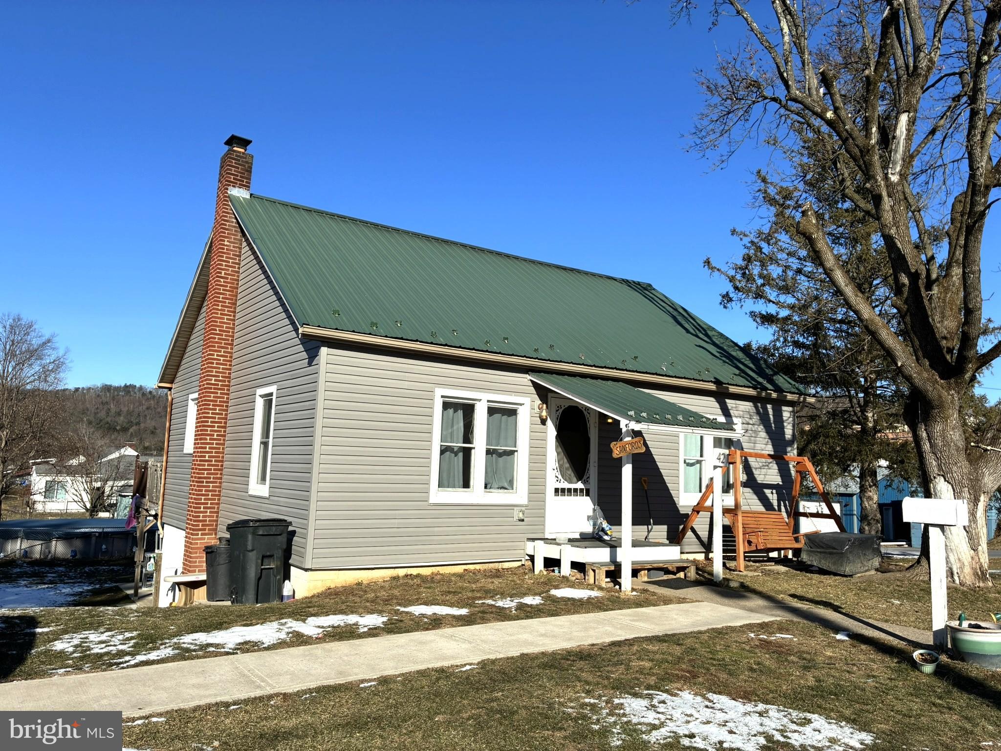 421 James Street Lock Haven, PA 17745 - Photo 1 of 34 Charming home with a green metal roof.