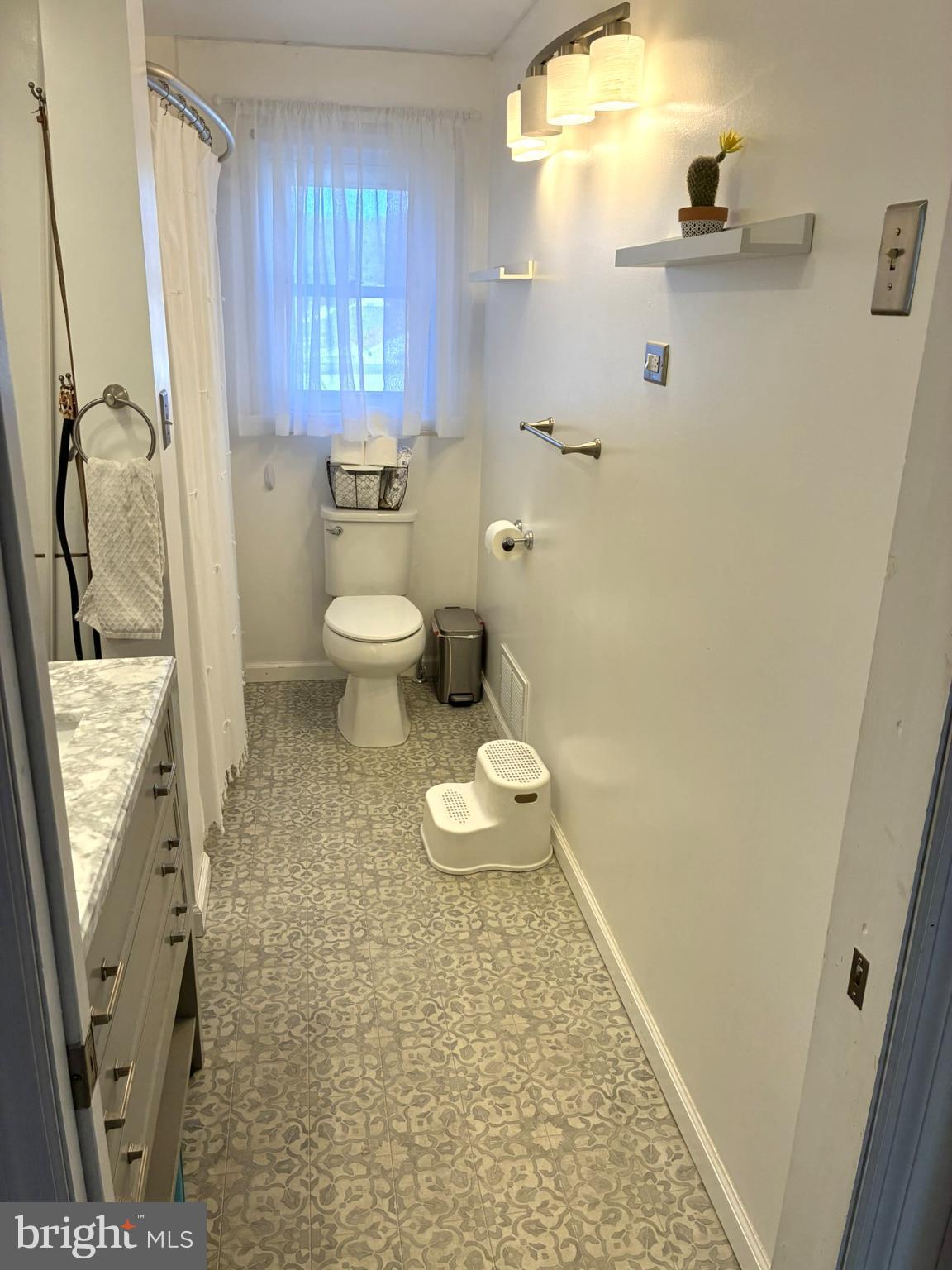 421 James Street Lock Haven, PA 17745 - Photo 24 of 34 Bright and airy bathroom with modern charm.