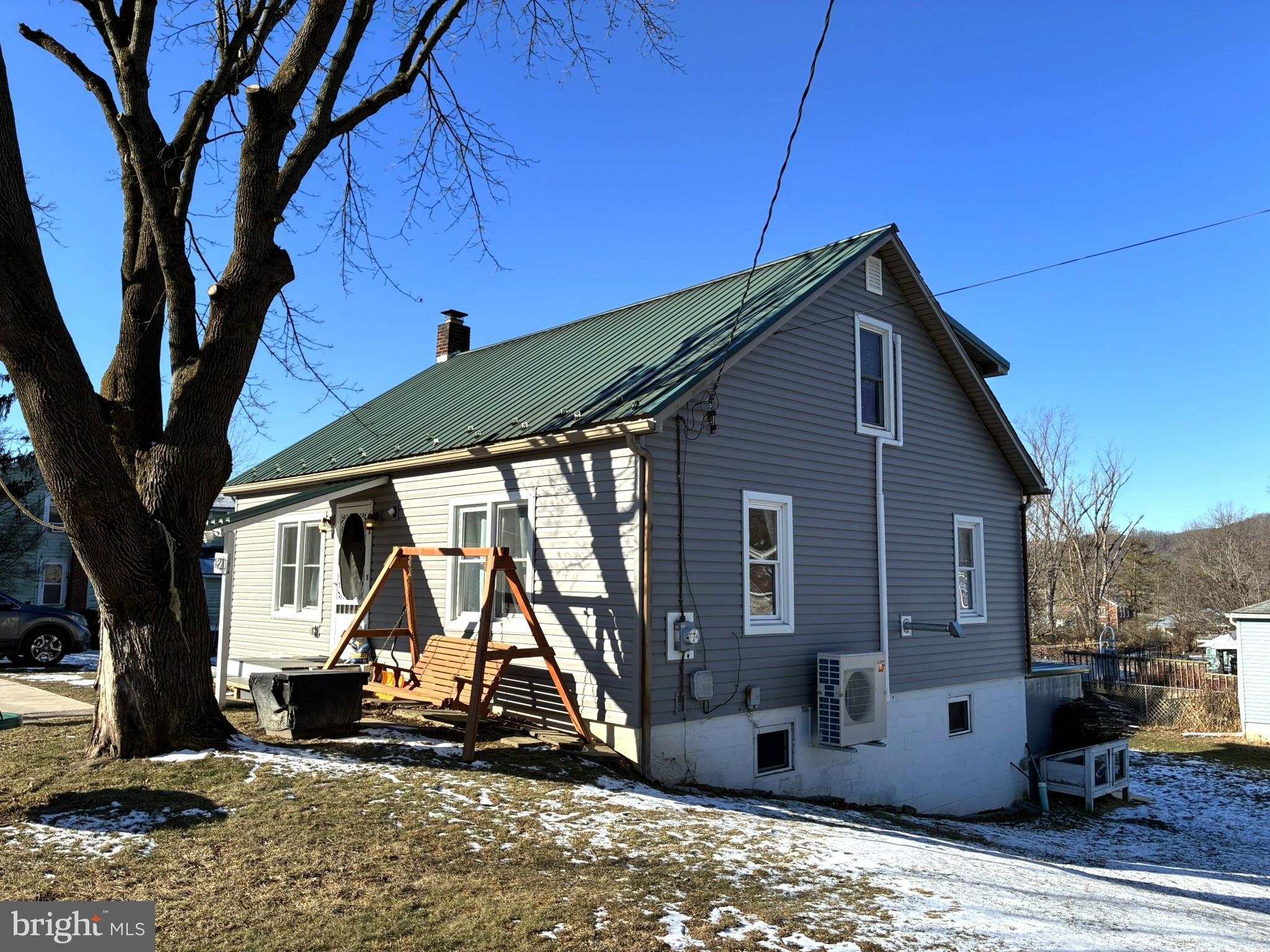 421 James Street Lock Haven, PA 17745 - Photo 31 of 39 Charming home with a green metal roof.