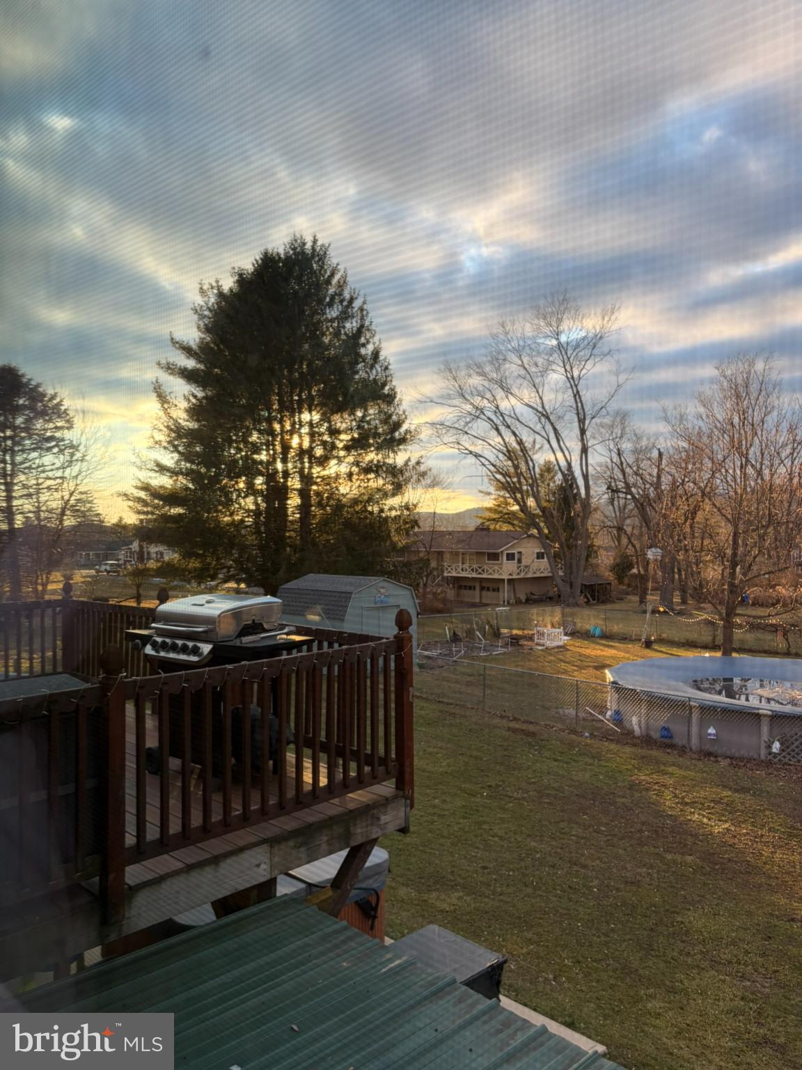 421 James Street Lock Haven, PA 17745 - Photo 39 of 39 Serene sunset over a tranquil backyard.