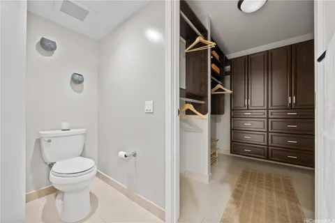 a bathroom with a toilet and shower