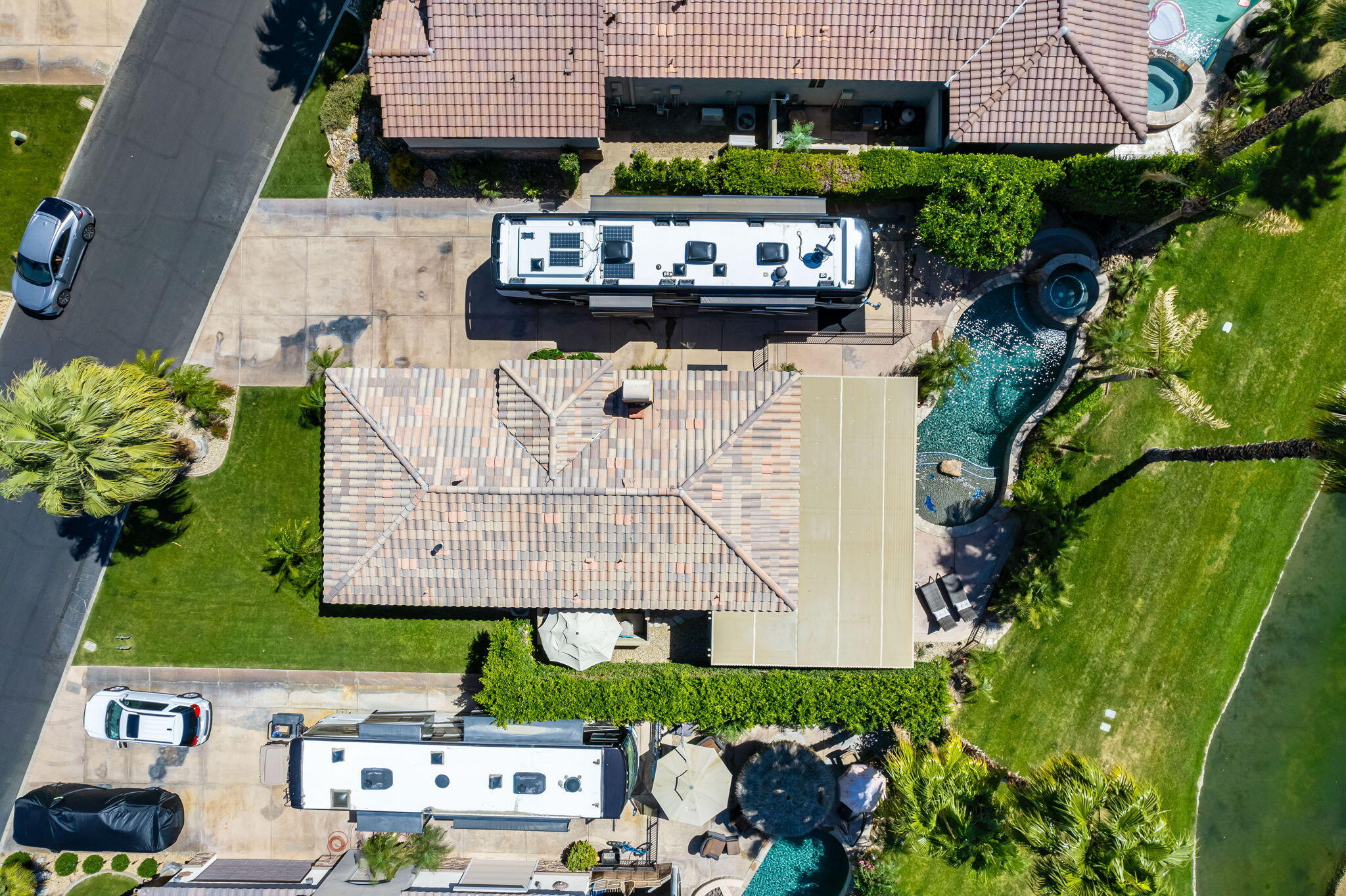 48170 Hjorth Street, Unit 74 Indio, CA 92201 - Photo 1 of 37 an aerial view of a house with garden space and sitting area