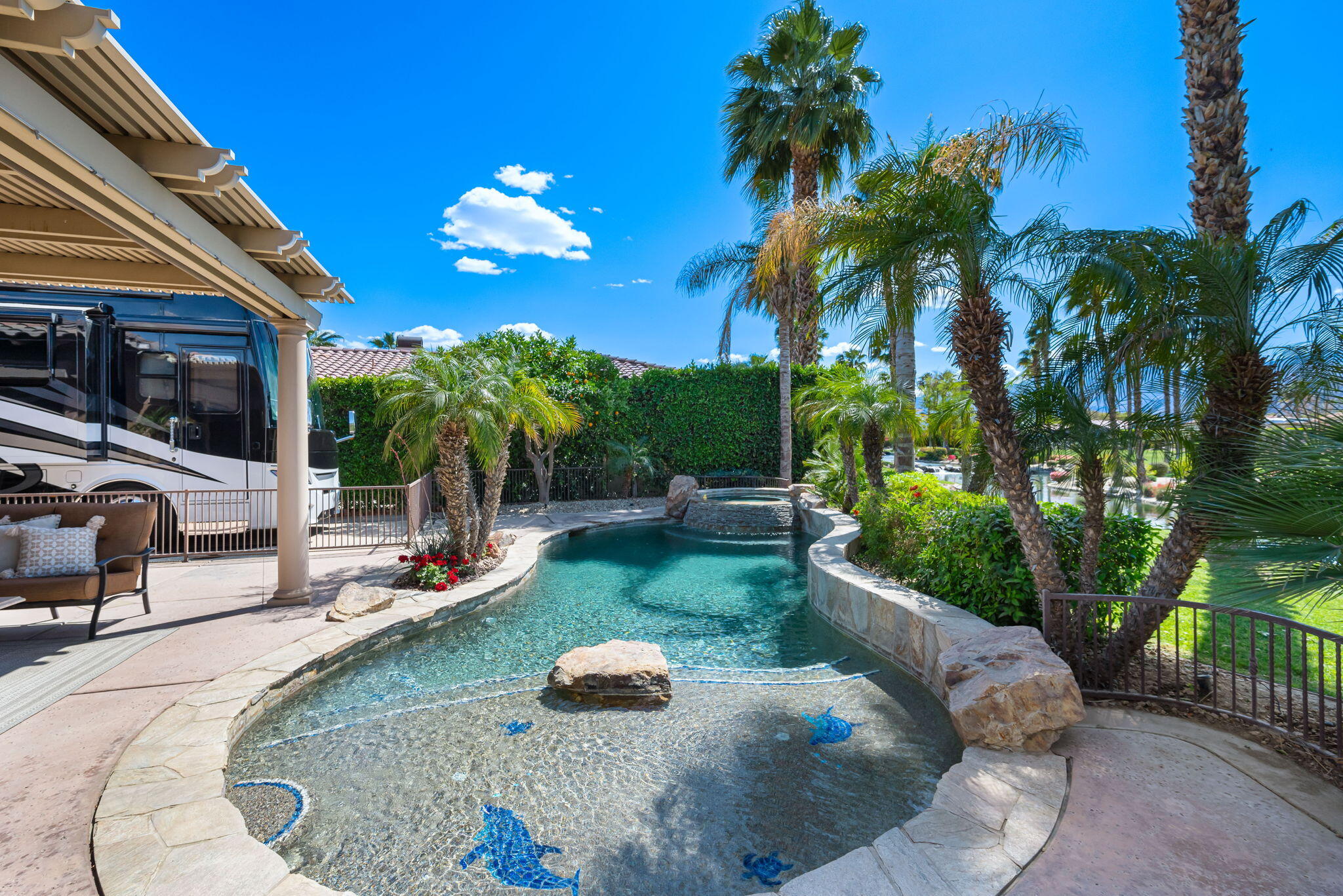 48170 Hjorth Street, Unit 74 Indio, CA 92201 - Photo 16 of 37 a view of a swimming pool with a patio