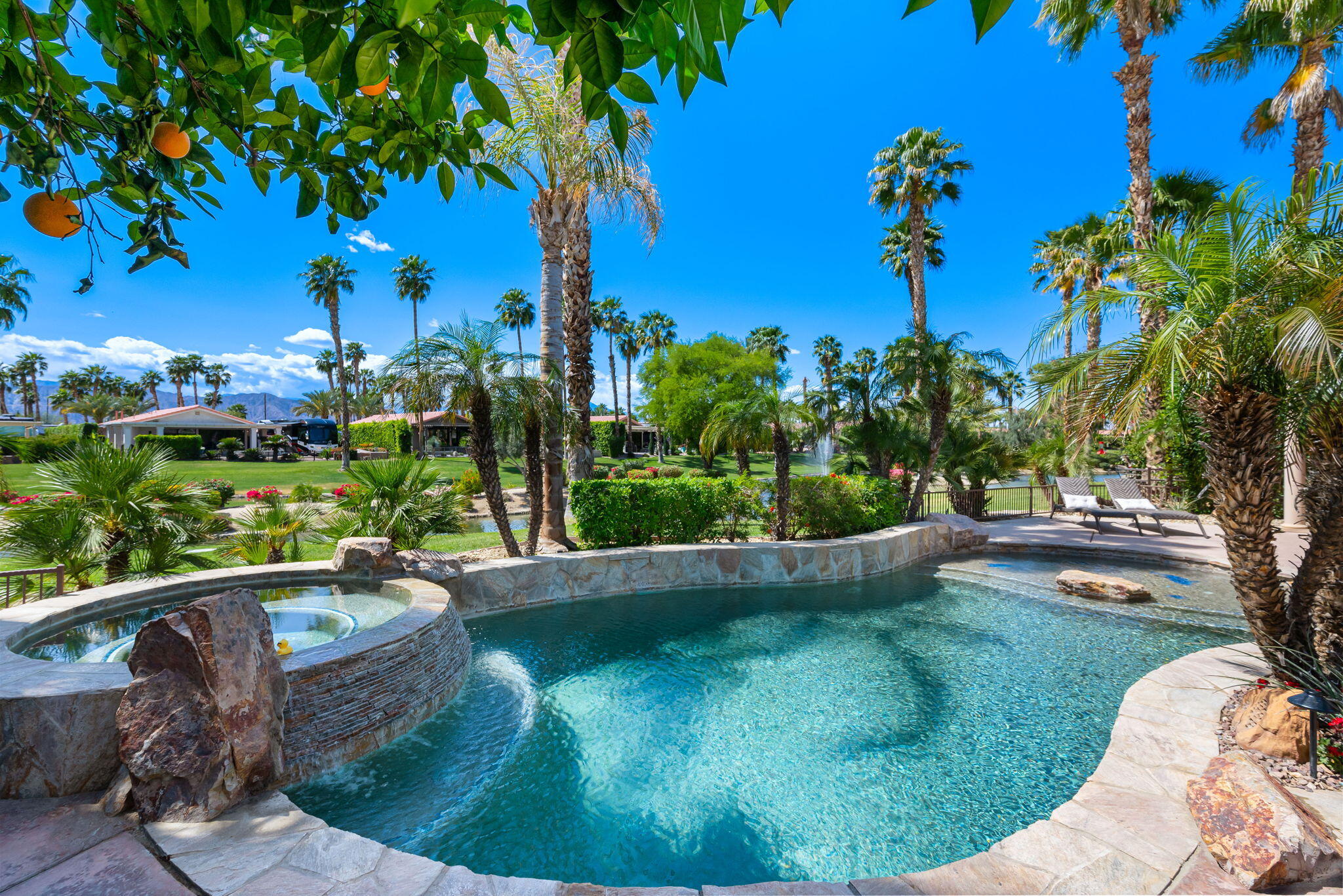 48170 Hjorth Street, Unit 74 Indio, CA 92201 - Photo 19 of 37 a view of a swimming pool with a patio