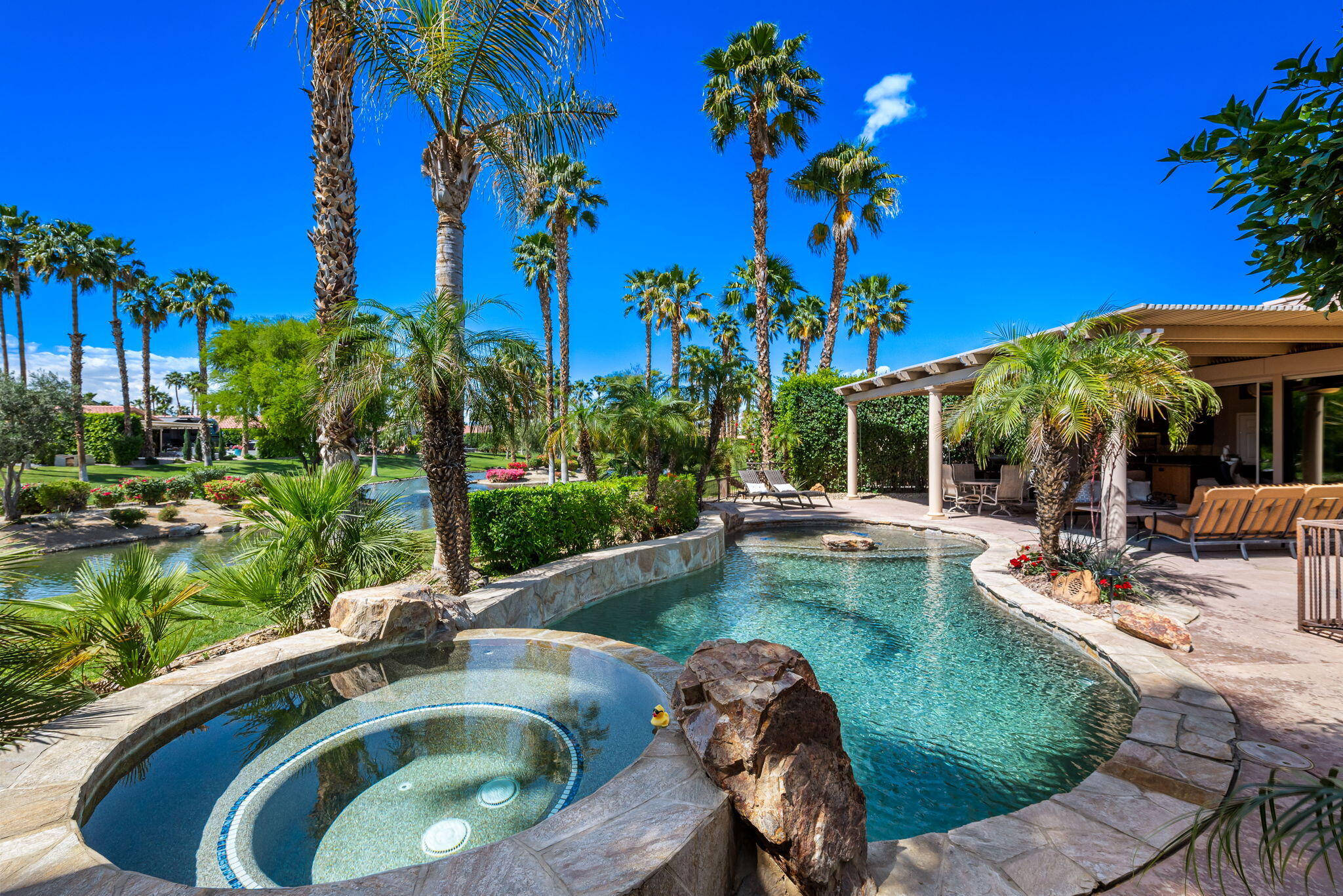 48170 Hjorth Street, Unit 74 Indio, CA 92201 - Photo 20 of 37 a view of a house with swimming pool and sitting area