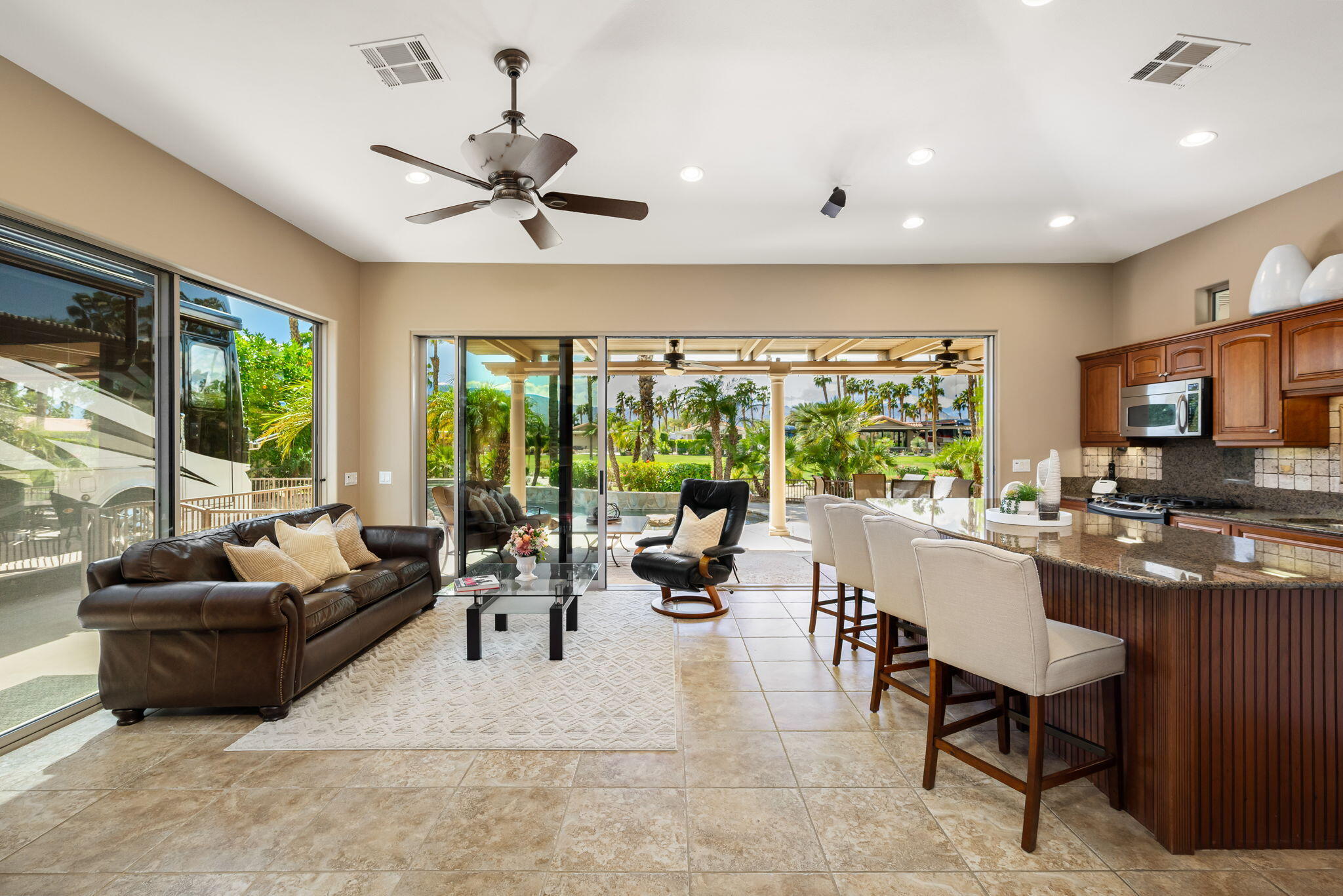 48170 Hjorth Street, Unit 74 Indio, CA 92201 - Photo 24 of 37 a living room with furniture and a large window