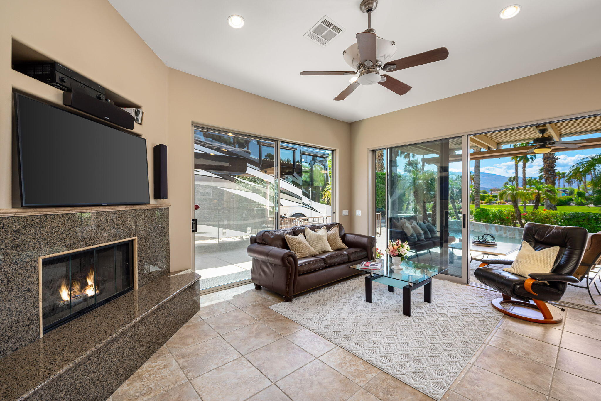 48170 Hjorth Street, Unit 74 Indio, CA 92201 - Photo 25 of 37 a living room with furniture and a fireplace