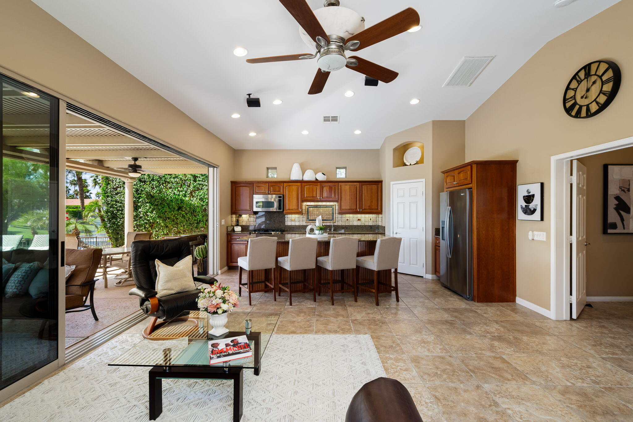 48170 Hjorth Street, Unit 74 Indio, CA 92201 - Photo 26 of 37 a living room with lots of furniture and a large window