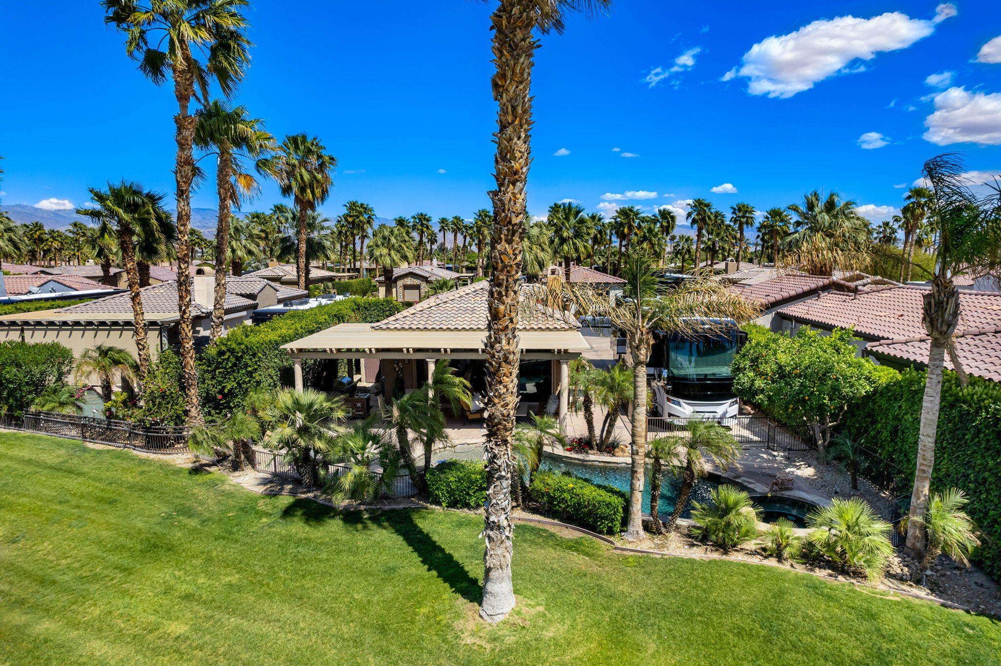 48170 Hjorth Street, Unit 74 Indio, CA 92201 - Photo 3 of 37 a view of a house with a yard