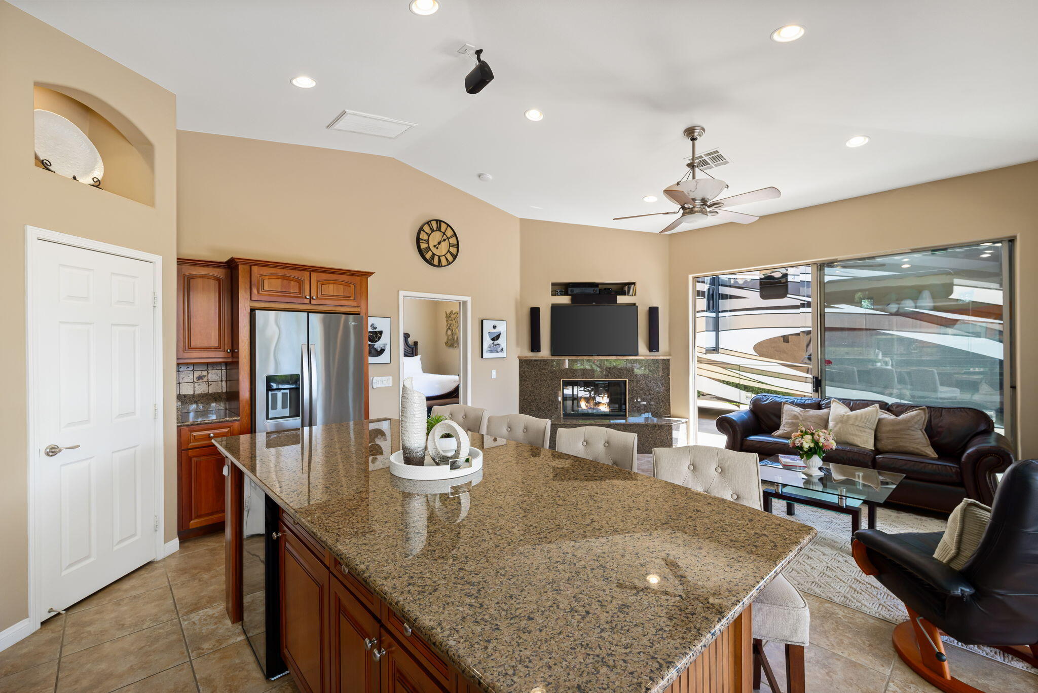 48170 Hjorth Street, Unit 74 Indio, CA 92201 - Photo 31 of 37 a view of a dining room with furniture a kitchen and chandelier