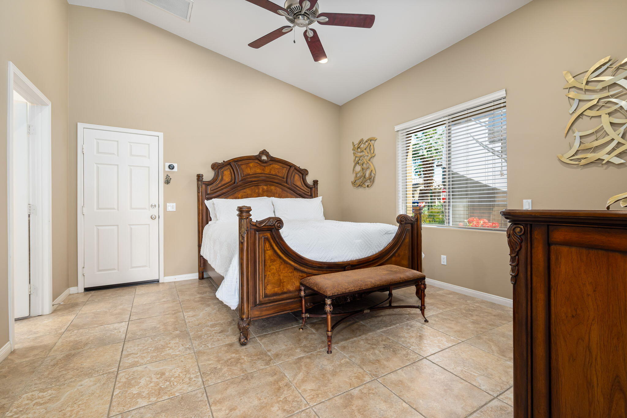 48170 Hjorth Street, Unit 74 Indio, CA 92201 - Photo 33 of 37 a living room with furniture a window and a chandelier