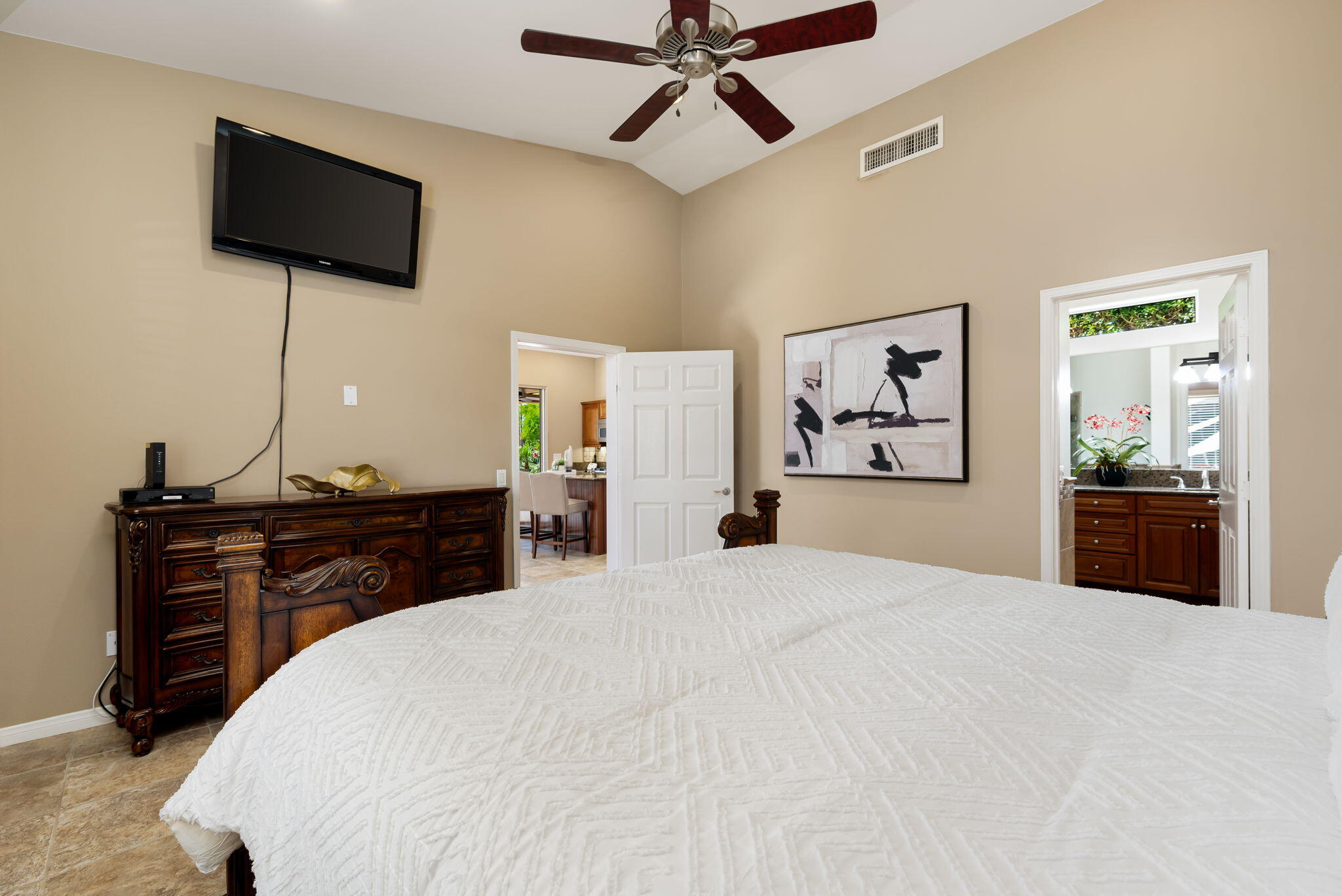 48170 Hjorth Street, Unit 74 Indio, CA 92201 - Photo 34 of 37 a bedroom with a bed and a flat screen tv