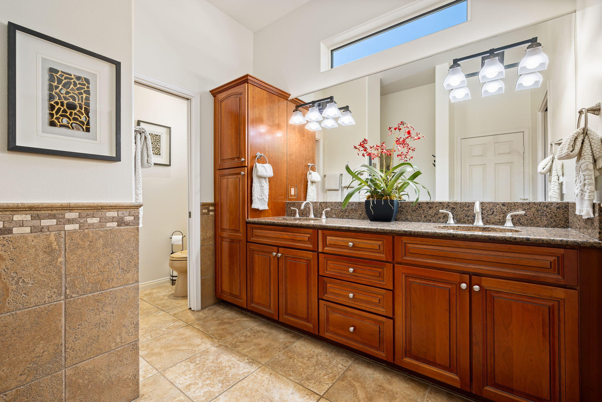 48170 Hjorth Street, Unit 74 Indio, CA 92201 - Photo 35 of 37 a bathroom with a granite countertop sink a mirror and a shower