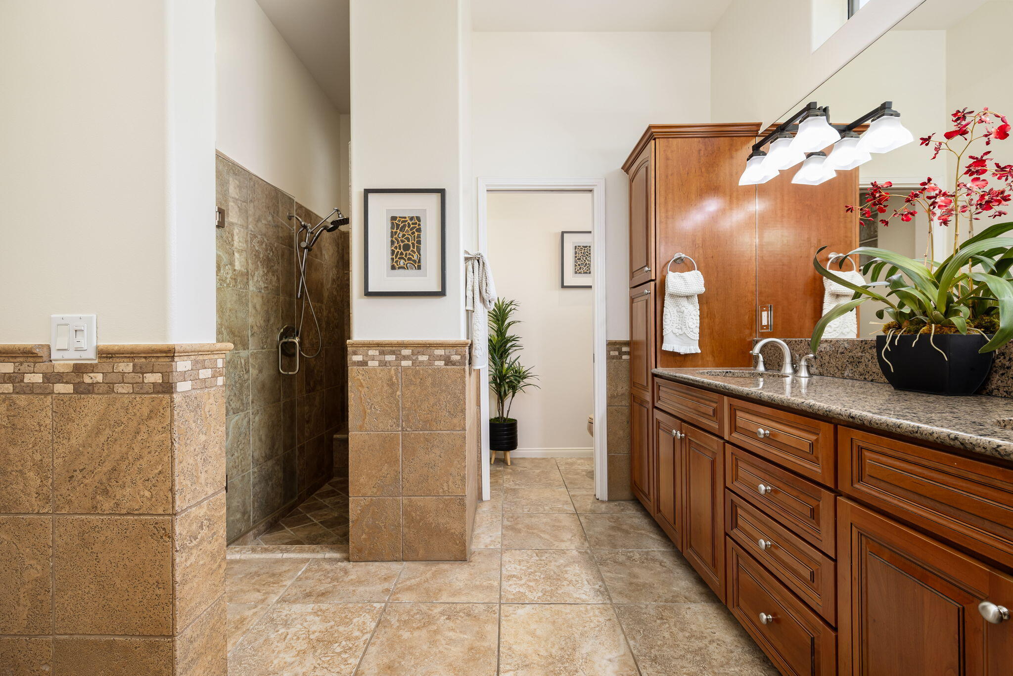 48170 Hjorth Street, Unit 74 Indio, CA 92201 - Photo 36 of 37 a spacious bathroom with a double vanity sink and a mirror
