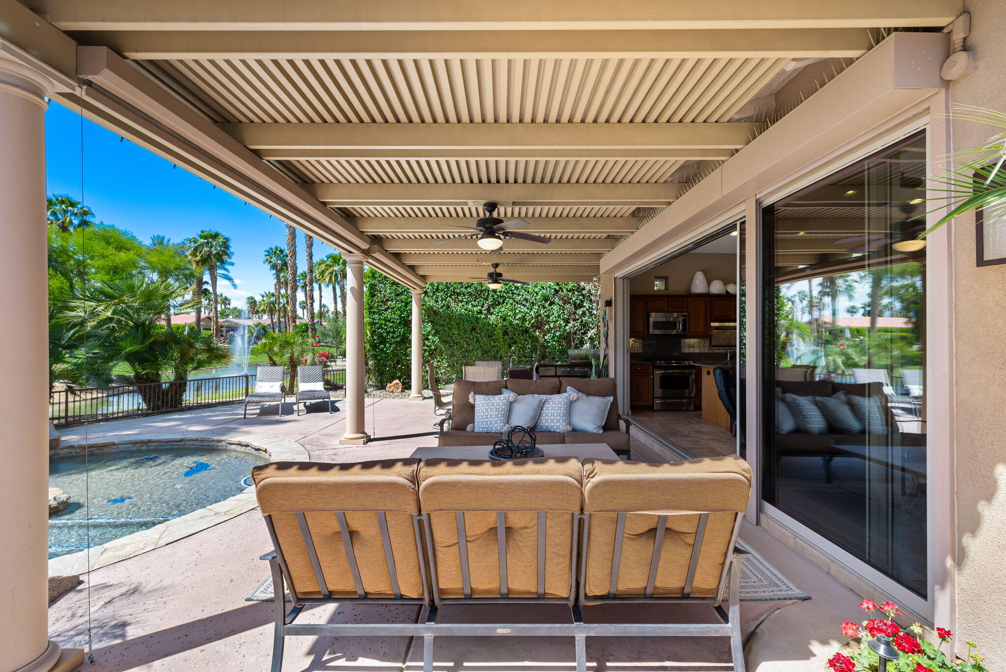 48170 Hjorth Street, Unit 74 Indio, CA 92201 - Photo 8 of 37 a view of an outdoor sitting area with furniture and garden view