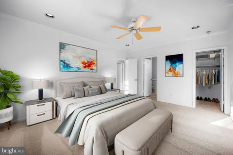 a bathroom with a sink a toilet a mirror and shower curtain