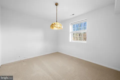 a view of a door with a small yard