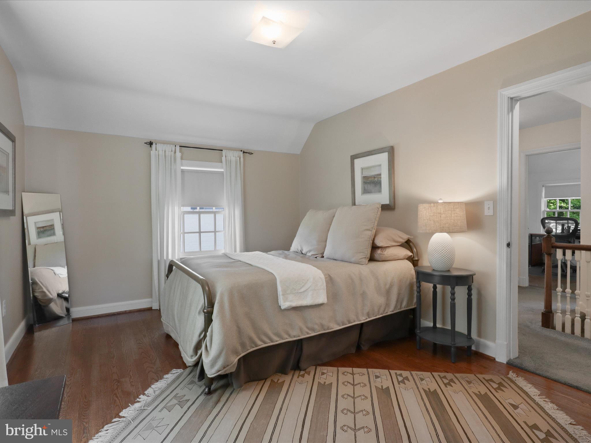 4725 Rock Spring Road Arlington, VA 22207 - Photo 30 of 59 a bedroom with a bed and wooden floor