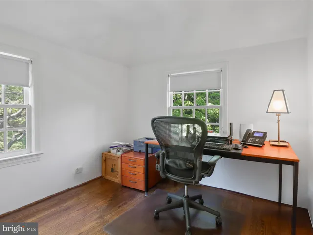 a workspace with furniture and a window
