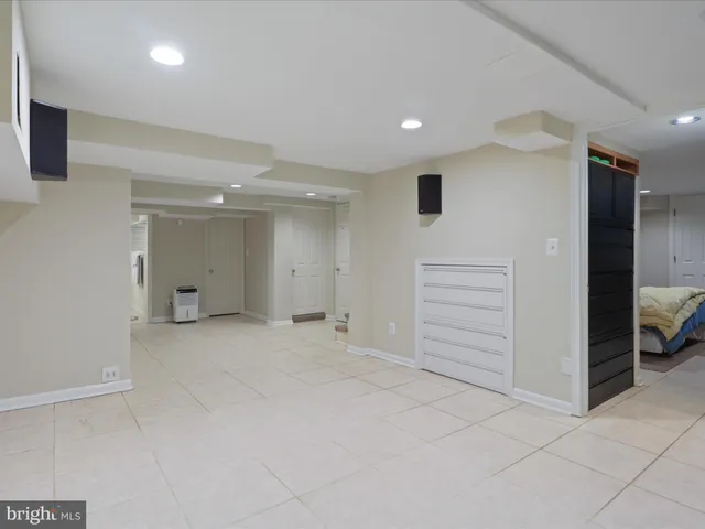 a bathroom with a sink a mirror and shower